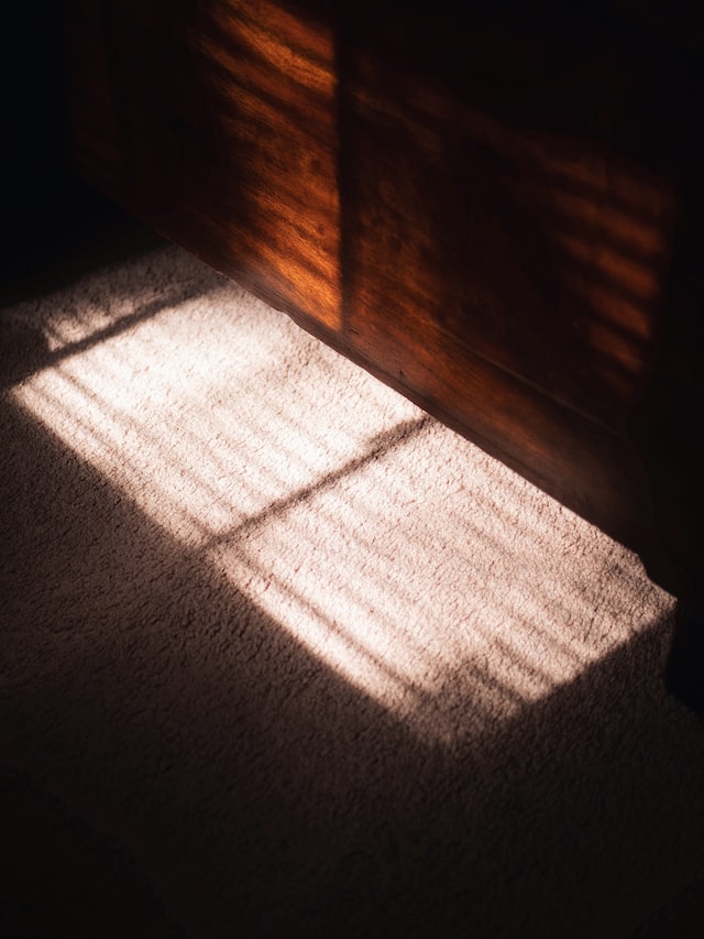 wood blinds shadow on light
